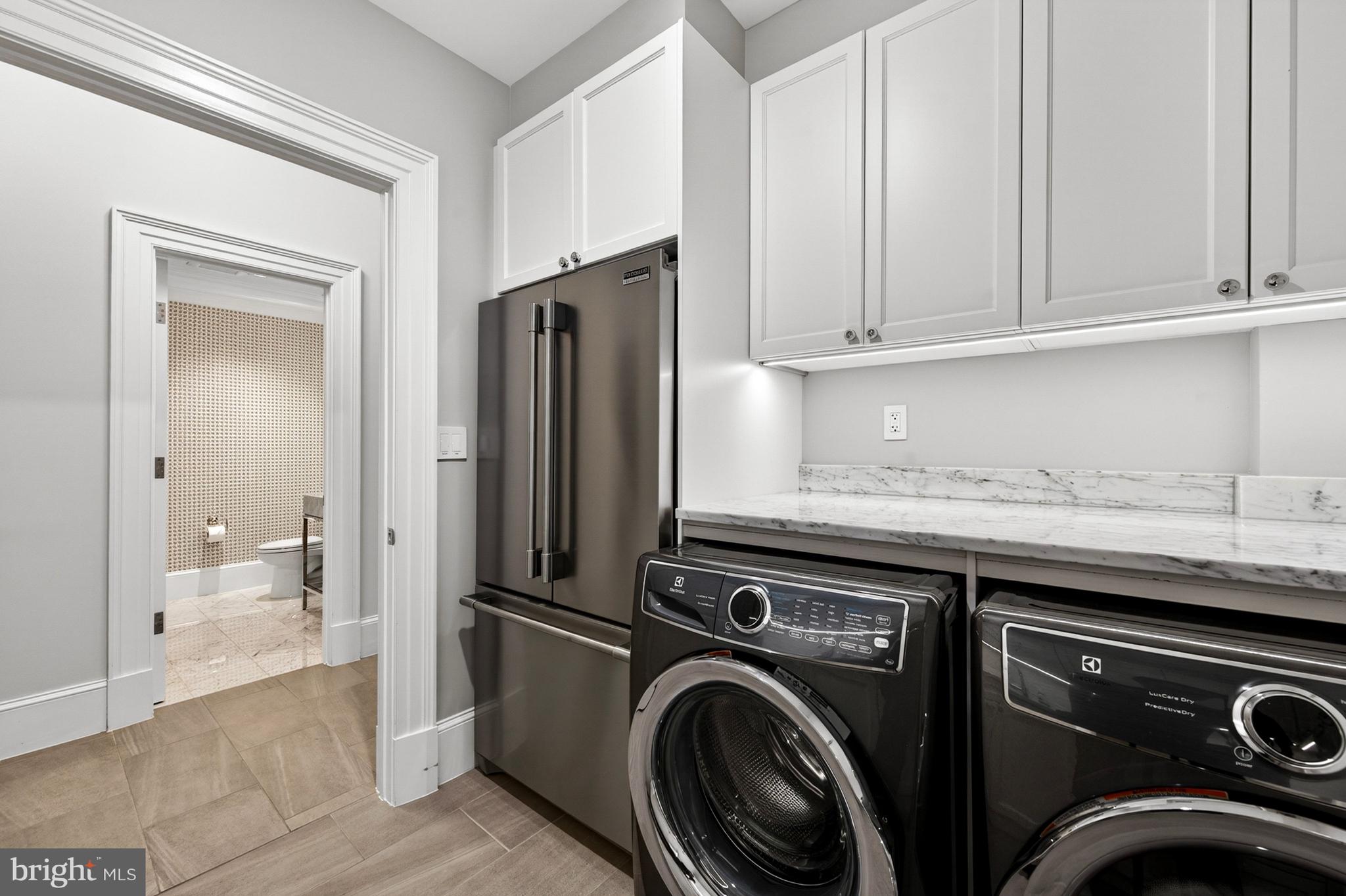 4432 Chestnut Lane Washington, DC 20007 - Photo 41 of 43 Lower Level Laundry room with full refrigerator