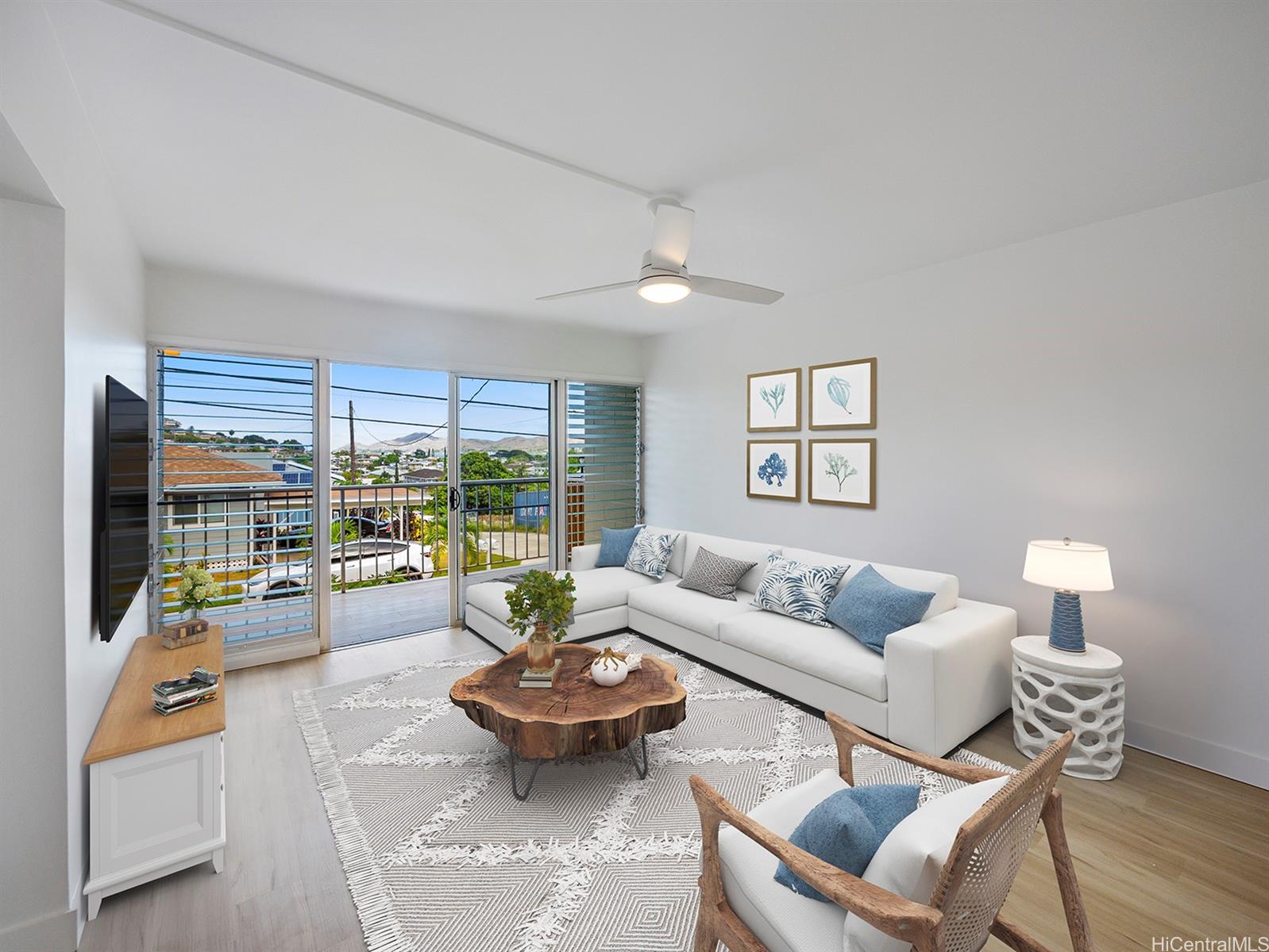 a living room with furniture and a large window