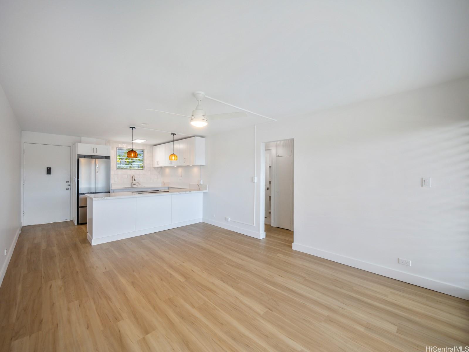 45-342 Lilipuna Road, Unit 204 Kaneohe, HI 96744 - Photo 17 of 25 a view of kitchen and hall with wooden floor