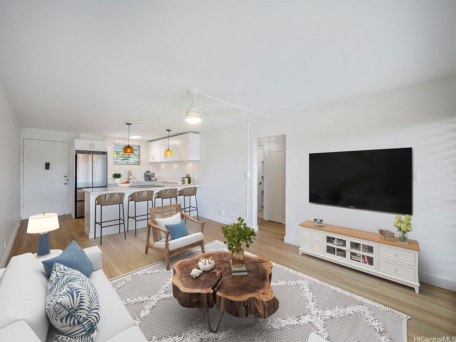 45-342 Lilipuna Road, Unit 204 Kaneohe, HI 96744 - Photo 2 of 25 a living room with furniture and a flat screen tv