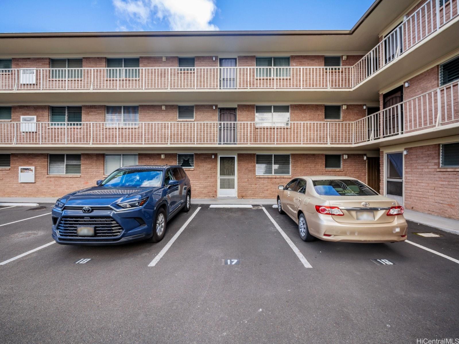 45-342 Lilipuna Road, Unit 204 Kaneohe, HI 96744 - Photo 25 of 25 a car parked in front of a brick building