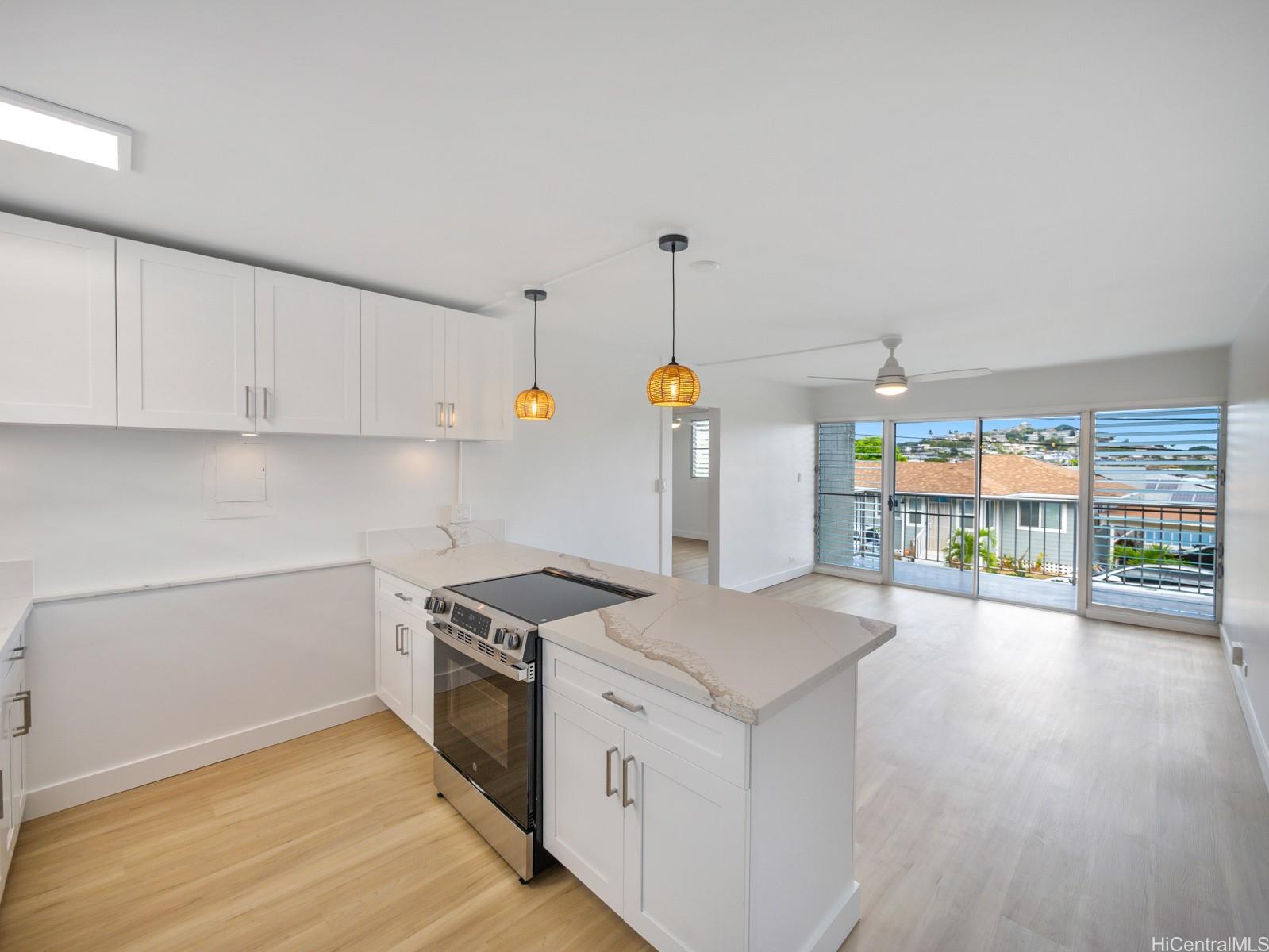 45-342 Lilipuna Road, Unit 204 Kaneohe, HI 96744 - Photo 10 of 25 a kitchen that has a lot of cabinets in it