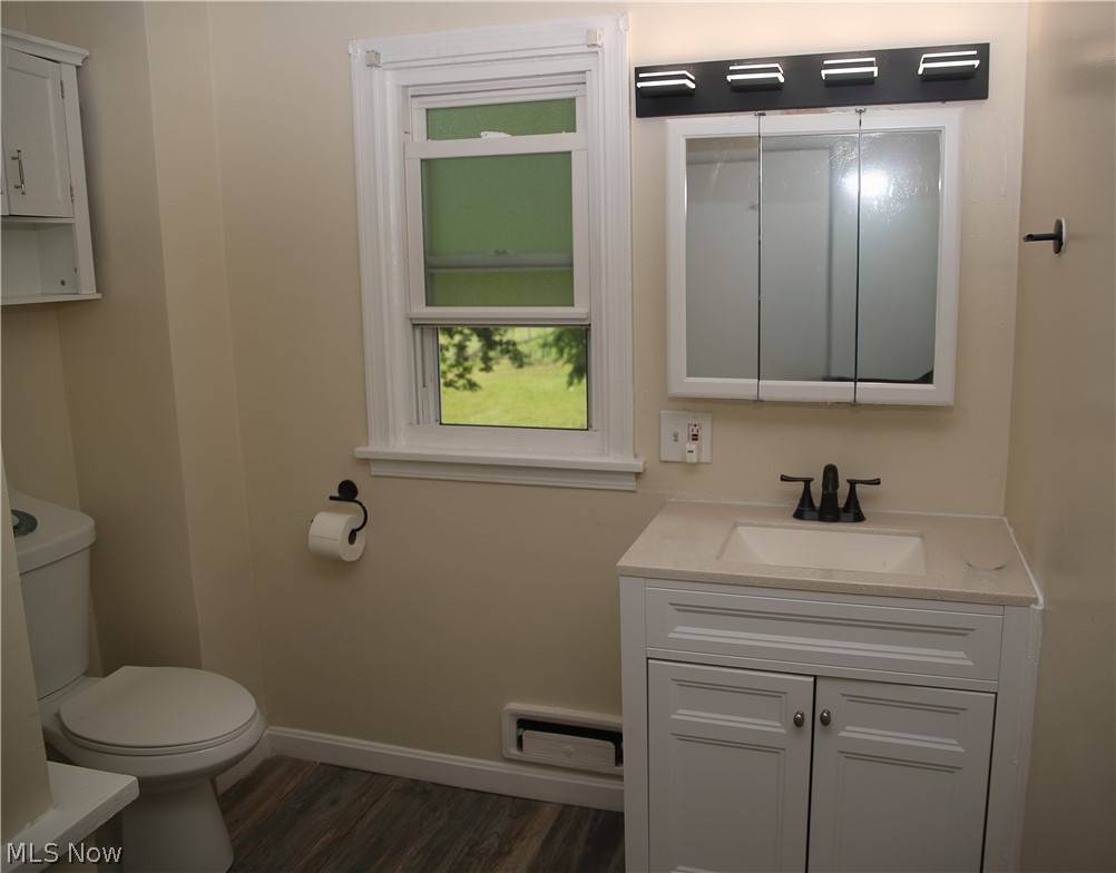 1087 Krumroy Road Akron, OH 44306 - Photo 20 of 23 Bathroom featuring a white vanity with a light-colored countertop, an integrated sink, and dark bronze-finish fixtures