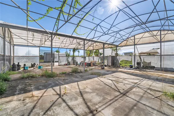 a view of a backyard with sitting area