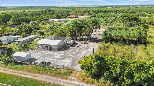a aerial view of a house with a yard