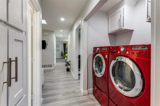 a view of storage and utility room with washer and dryer