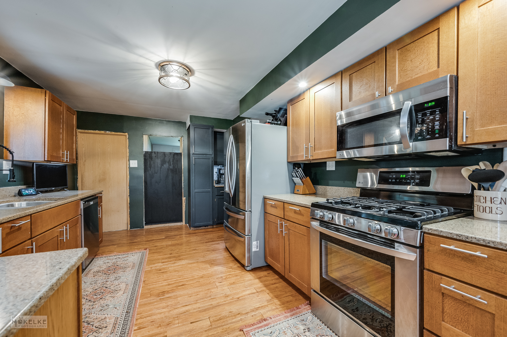 3494 Howlett Road Paw Paw, IL 61353 - Photo 11 of 47 a kitchen with stainless steel appliances granite countertop a stove a sink and a refrigerator