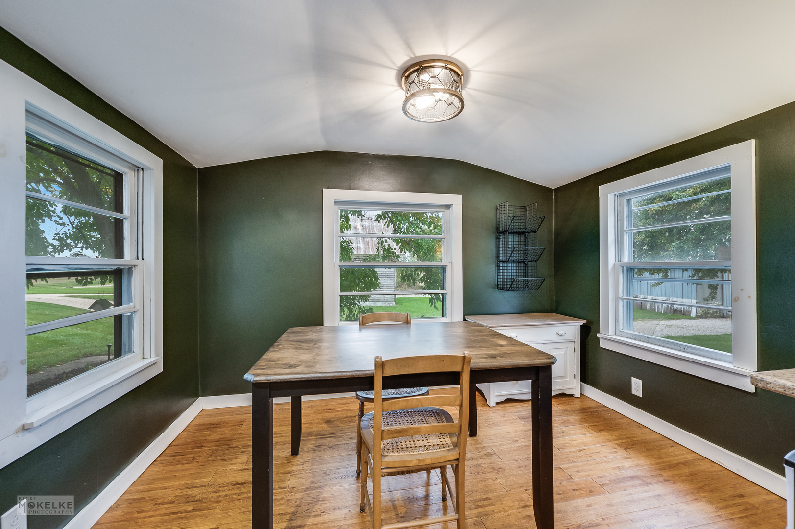 3494 Howlett Road Paw Paw, IL 61353 - Photo 13 of 47 a view of a dining room with furniture window and wooden floor