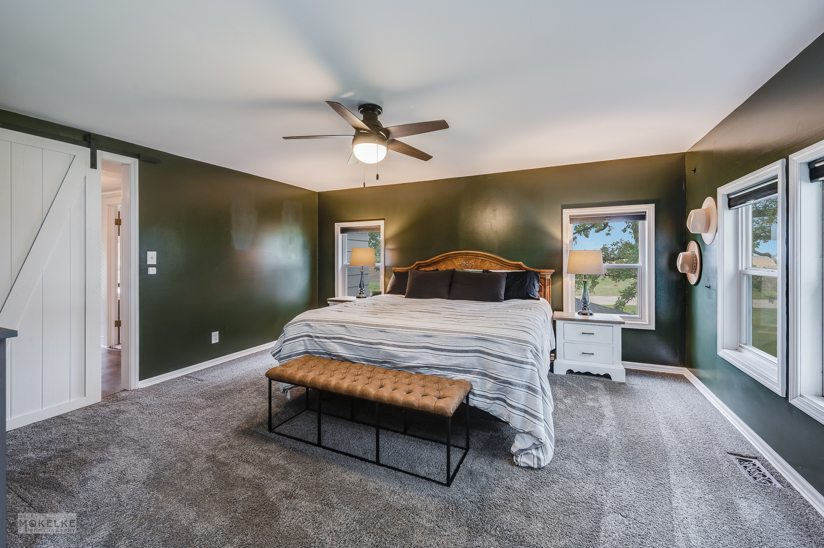3494 Howlett Road Paw Paw, IL 61353 - Photo 17 of 47 a bedroom with a large bed and a chandelier
