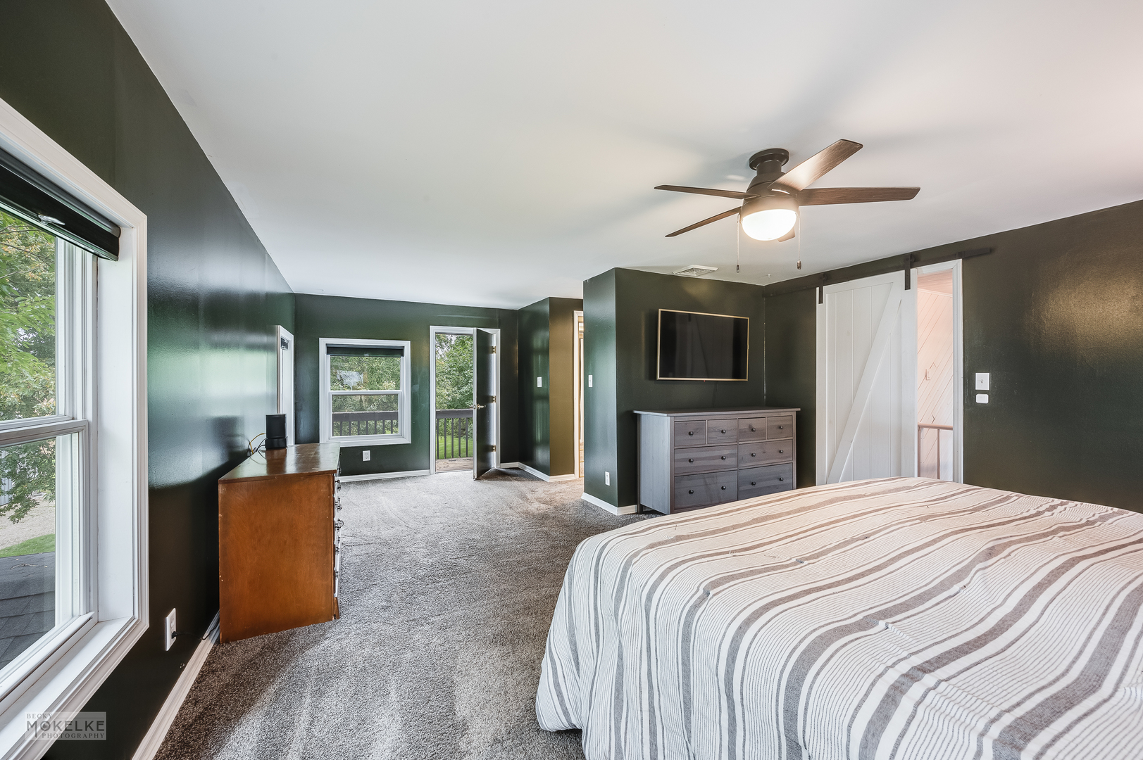 3494 Howlett Road Paw Paw, IL 61353 - Photo 18 of 47 a bedroom with a bed ceiling fan and a large window