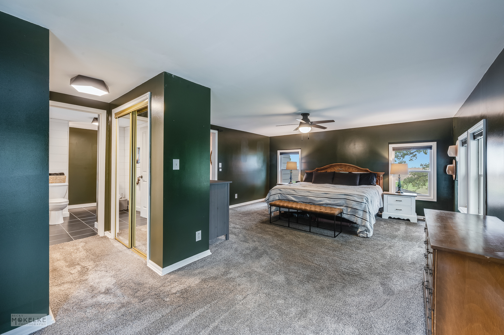 3494 Howlett Road Paw Paw, IL 61353 - Photo 21 of 47 a spacious bedroom with a bed and a chandelier