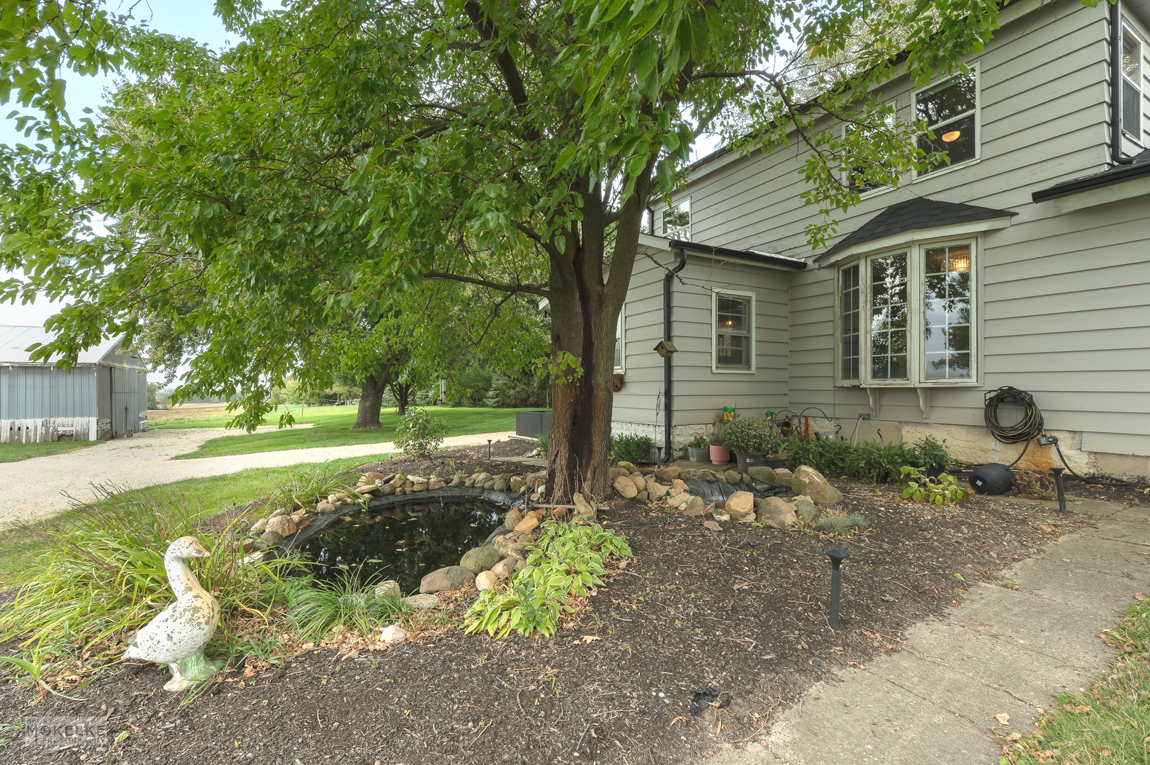 3494 Howlett Road Paw Paw, IL 61353 - Photo 28 of 47 a front view of a house with garden