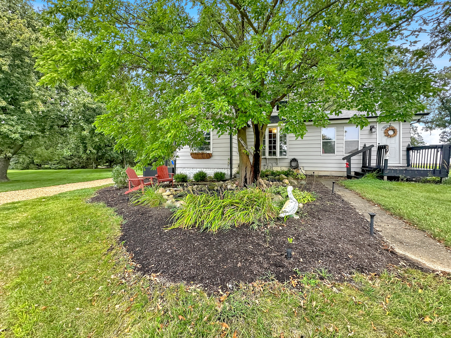 3494 Howlett Road Paw Paw, IL 61353 - Photo 30 of 47 a front view of a house with garden