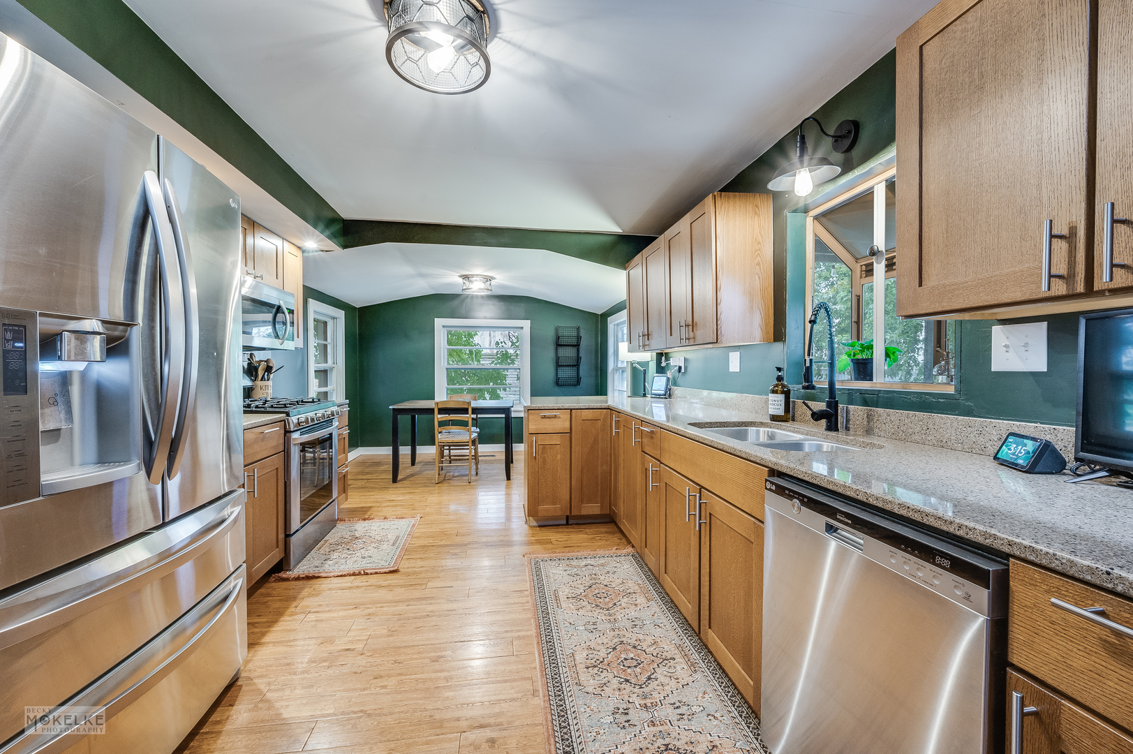 3494 Howlett Road Paw Paw, IL 61353 - Photo 9 of 47 a kitchen with stainless steel appliances granite countertop sink stove refrigerator and cabinets