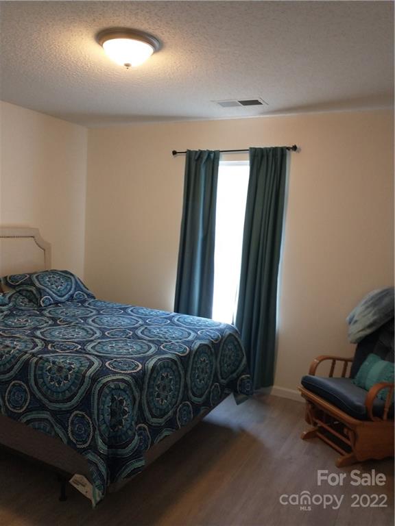 720 Raindrops Road Gastonia, NC 28054 - Photo 8 of 19 a bedroom with a bed and a window