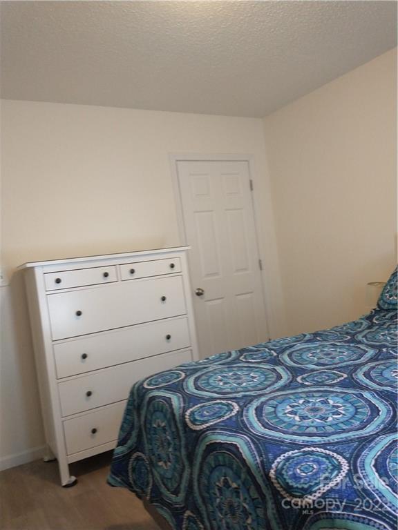 720 Raindrops Road Gastonia, NC 28054 - Photo 9 of 19 a bedroom with a bed and a window