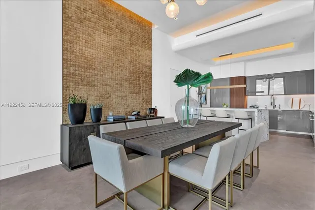 a dining room with furniture and wooden floor