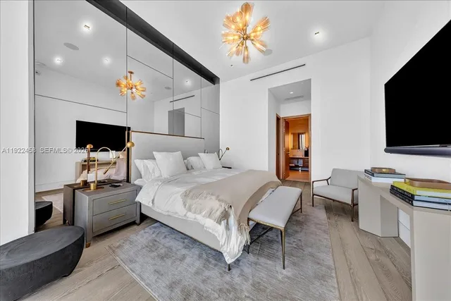 a view of a bathroom with a sink mirror and a bath tub