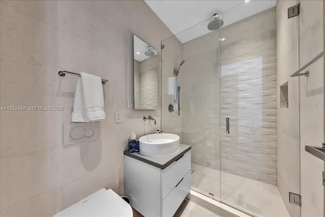 a bedroom with two beds and a window