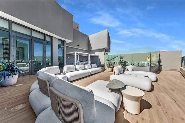 a kitchen with cabinets and wooden floor