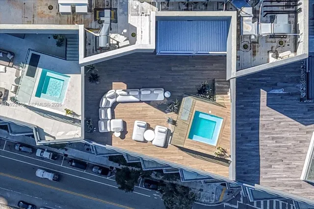 a view of a swimming pool with a patio