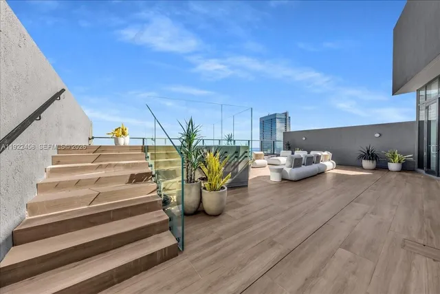 a view of a house with balcony and patio