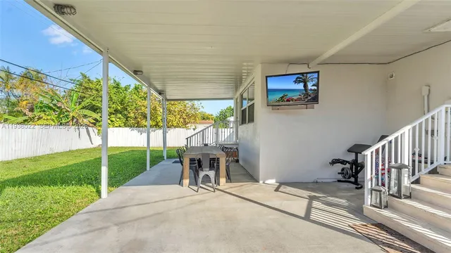 a view of a porch with wooden fence