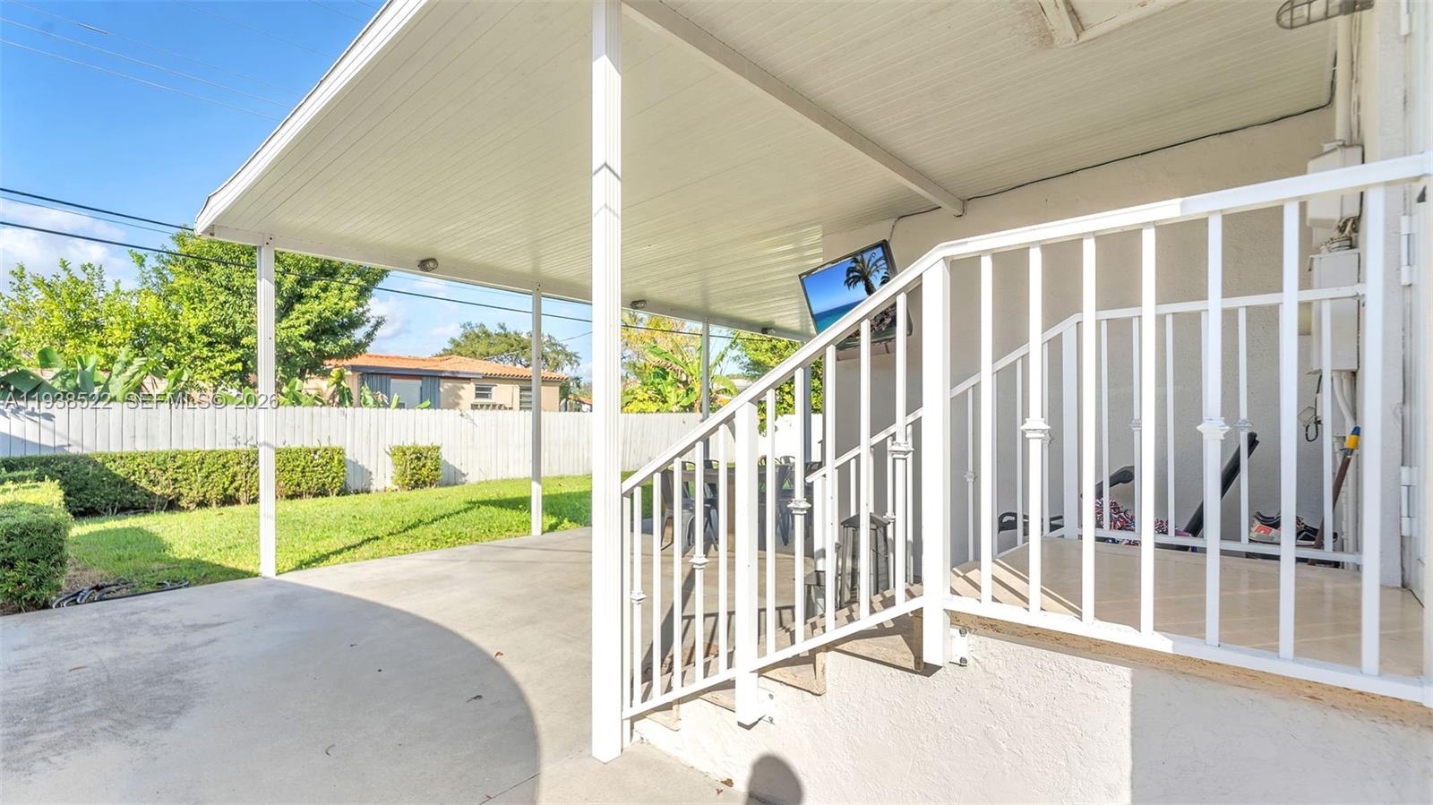 8261 Southwest 27th Street Miami, FL 33155 - Photo 17 of 27 a view of a porch with wooden fence