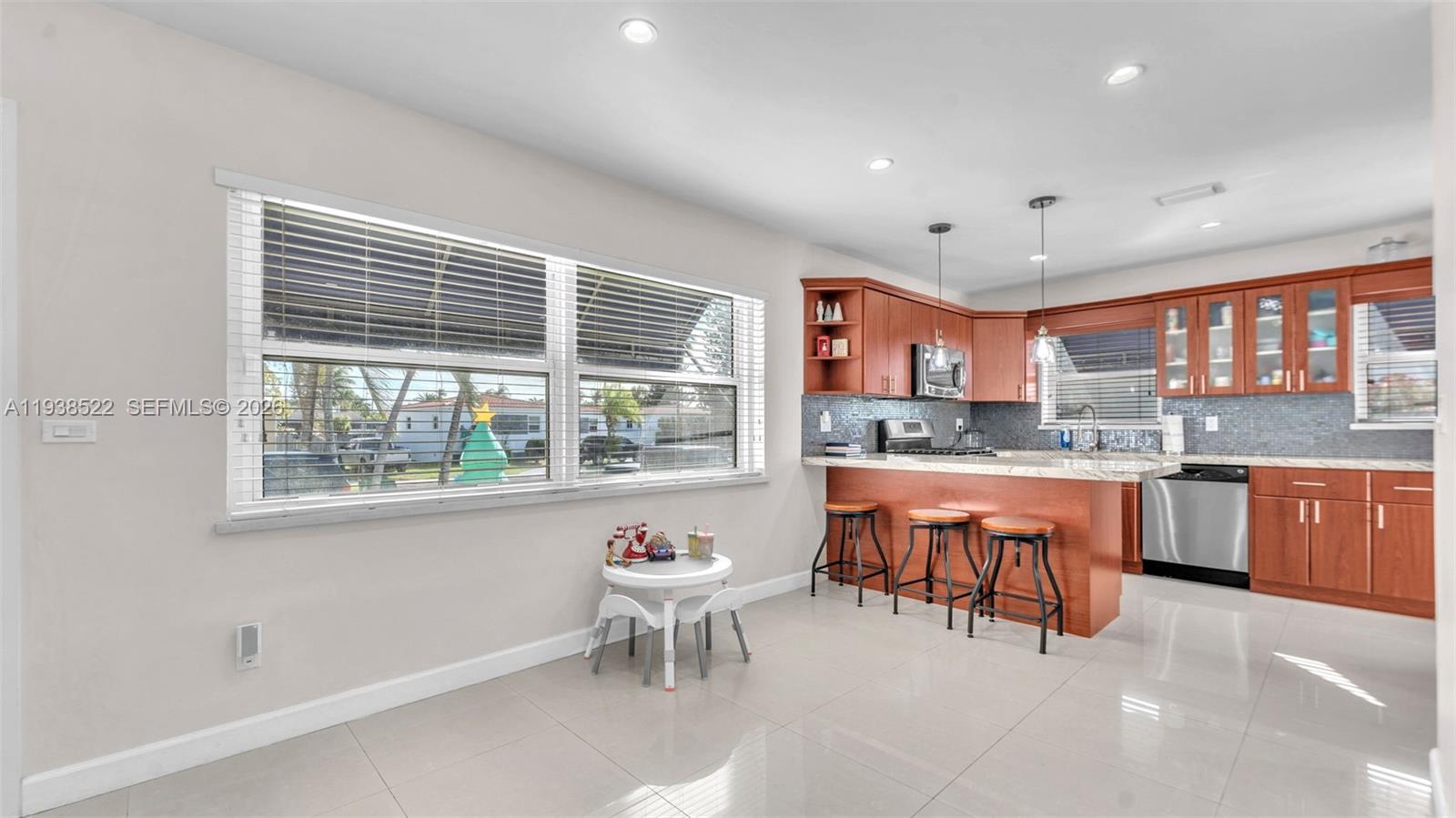 8261 Southwest 27th Street Miami, FL 33155 - Photo 19 of 27 a dinning table and kitchen with a large window