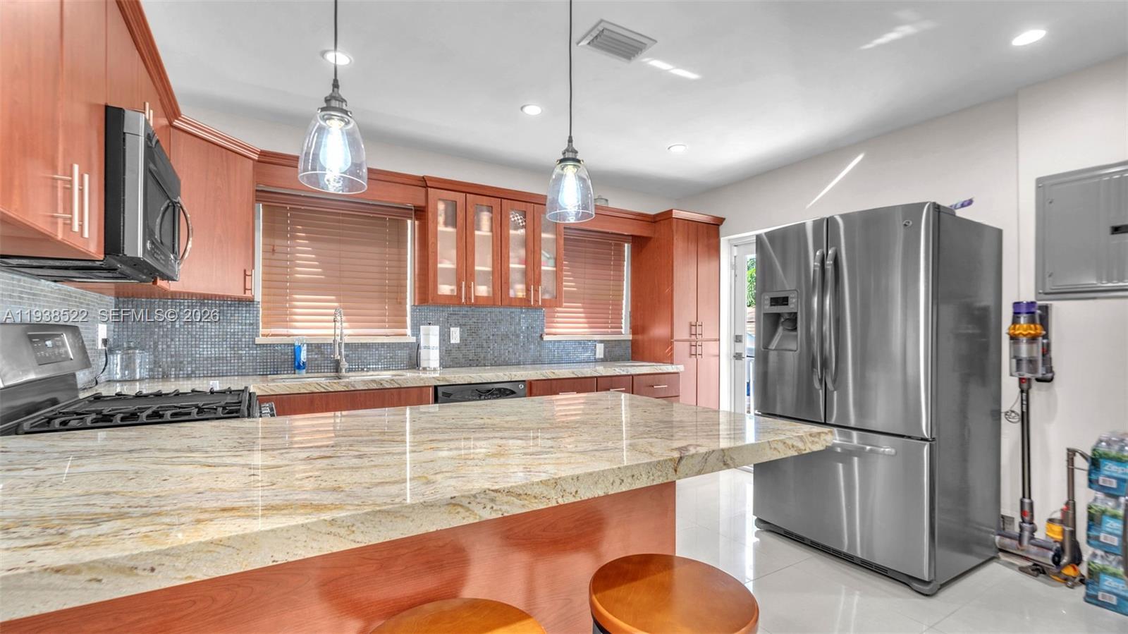 8261 Southwest 27th Street Miami, FL 33155 - Photo 22 of 27 a kitchen with refrigerator and window
