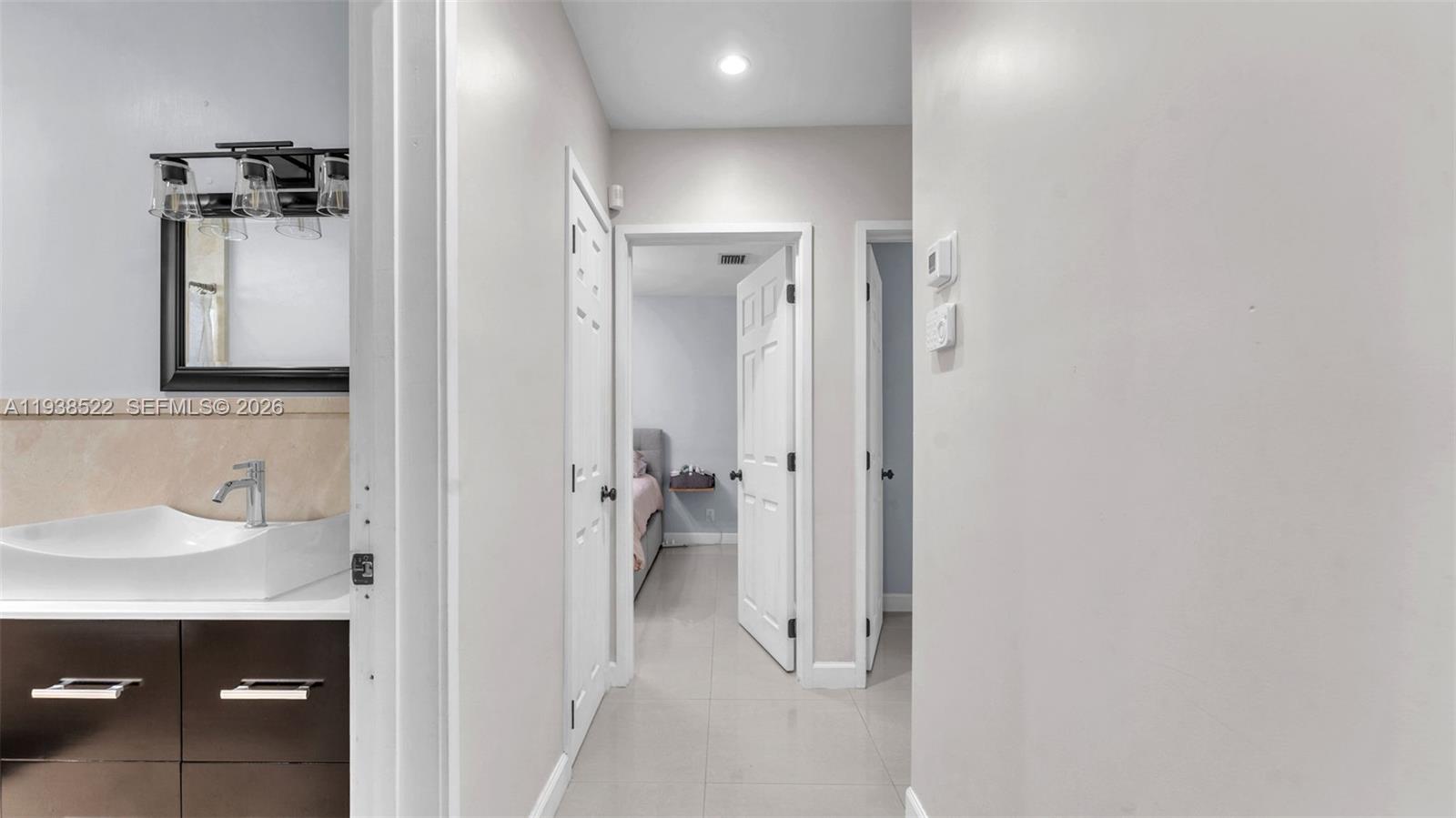 8261 Southwest 27th Street Miami, FL 33155 - Photo 26 of 27 a bathroom with a sink and a mirror