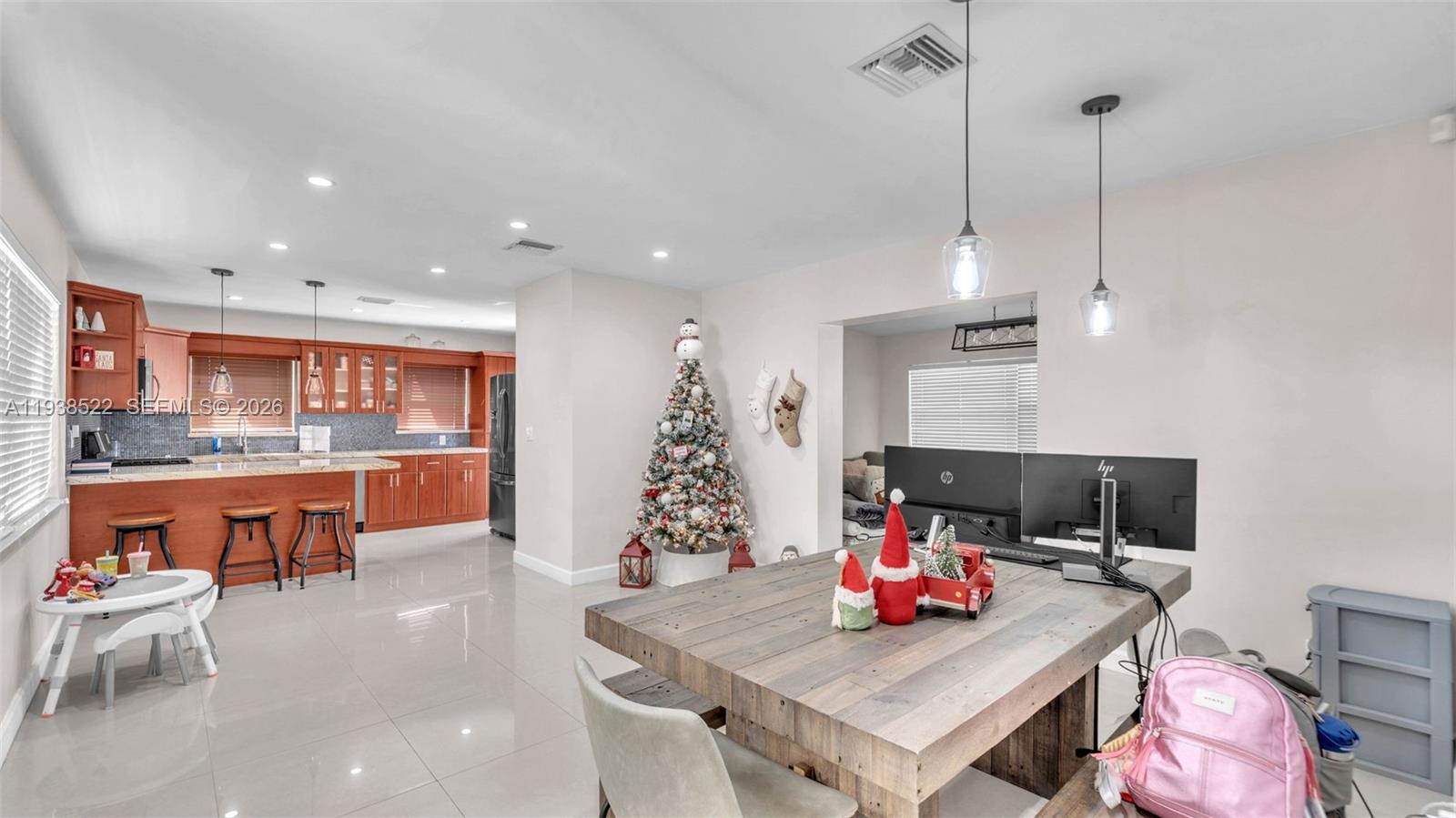 8261 Southwest 27th Street Miami, FL 33155 - Photo 5 of 27 a living room with furniture and kitchen view