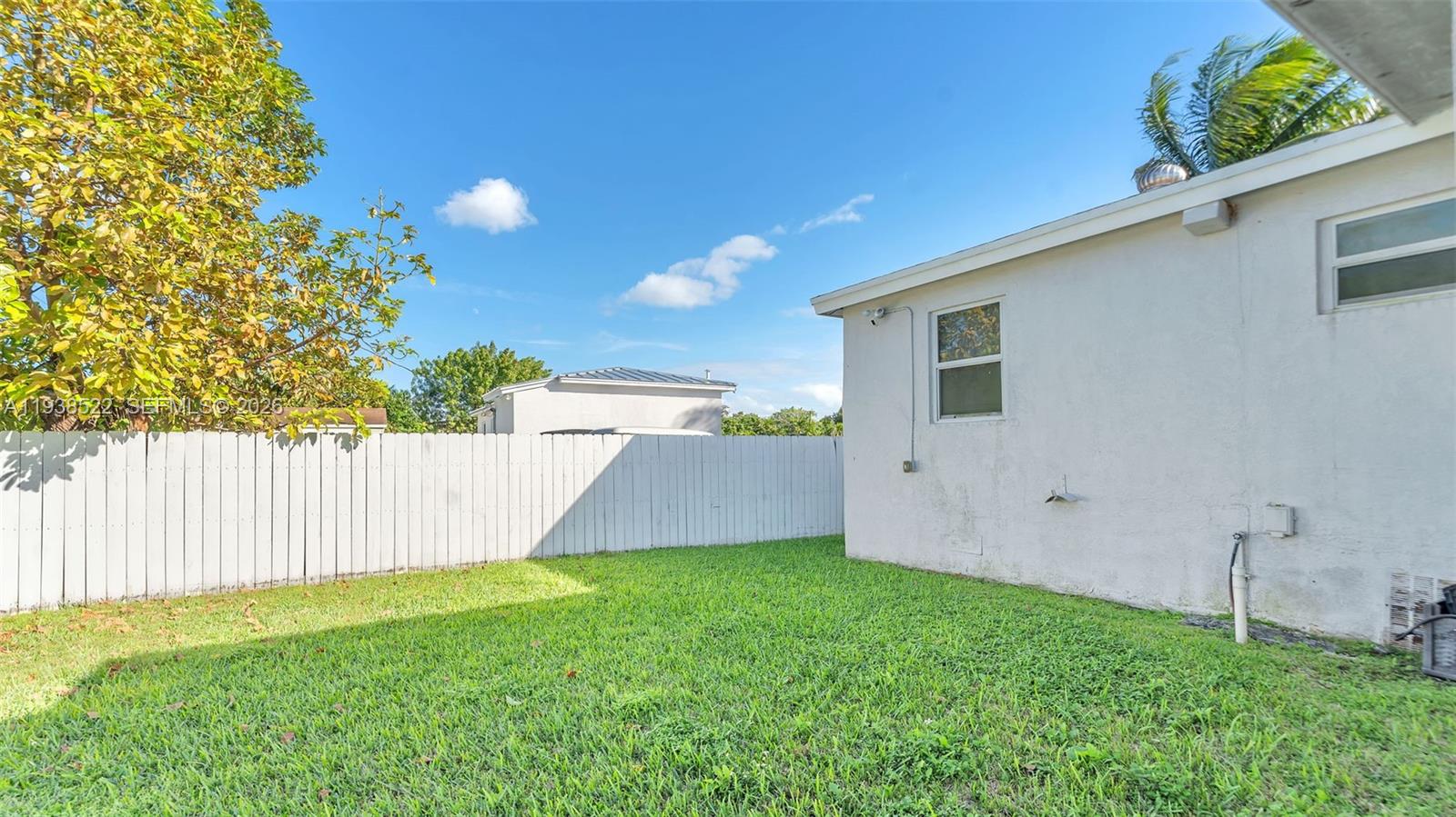 8261 Southwest 27th Street Miami, FL 33155 - Photo 9 of 27 a view of a backyard with a garden and plants
