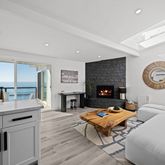 a living room with fireplace furniture and a fireplace