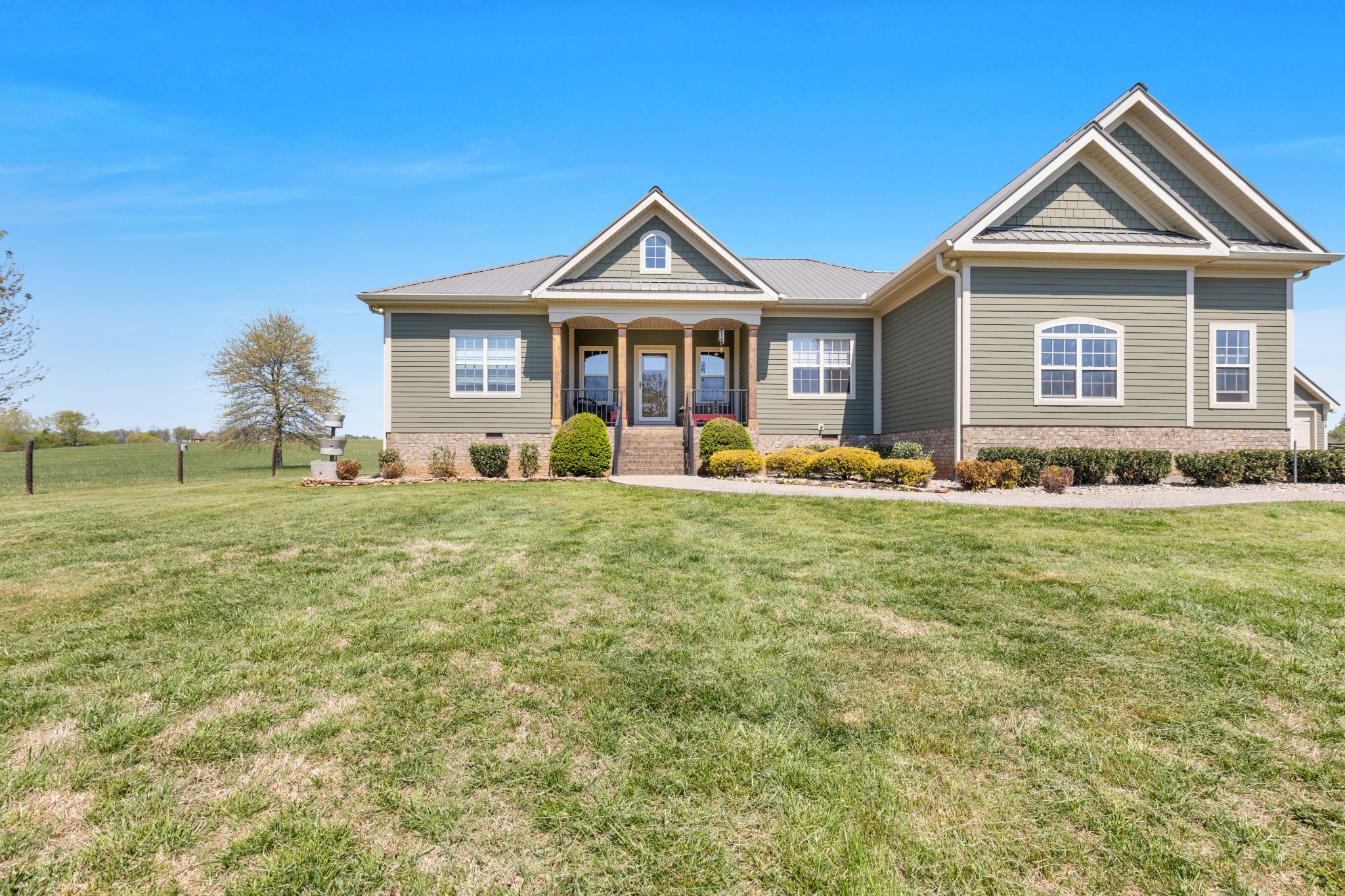 3988 Fykes Grove Road Cedar Hill, TN 37032 - Photo 39 of 50 a front view of a house with garden