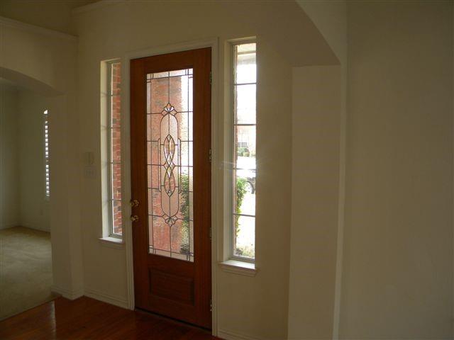 3608 Bent Ridge Drive Plano, TX 75074 - Photo 4 of 16 Entryway featuring arched walkways and dark wood-style flooring
