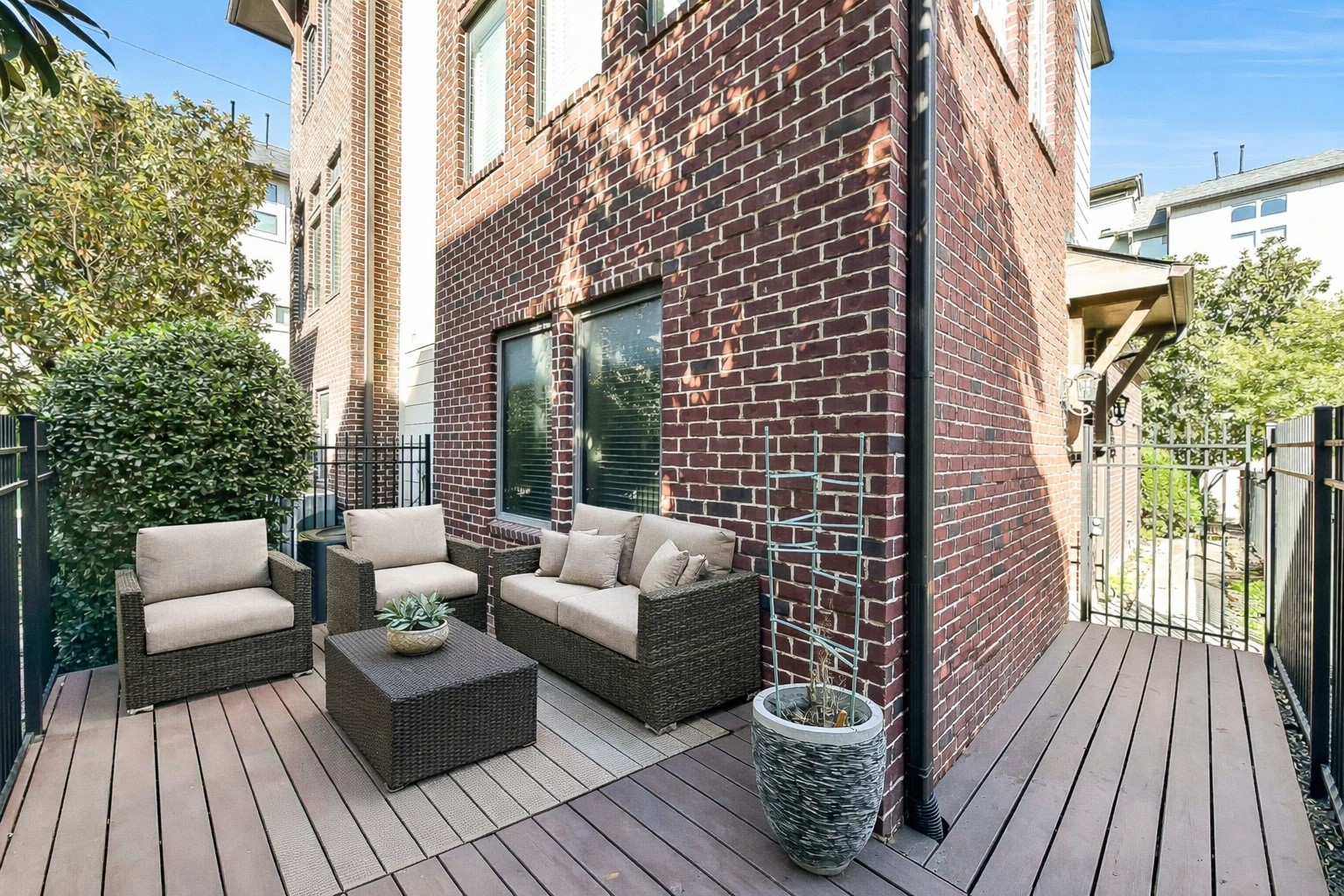 1929 Summer Street Houston, TX 77007 - Photo 5 of 27 1st floor back deck offers room for grilling and outdoor furniture, with privacy and peace of mind in a controlled-access community. Deck could be removed if you needed a grass area for pets.