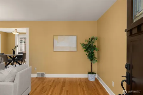a view of a livingroom with furniture and a potted plant