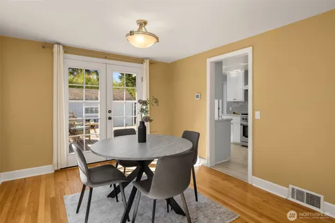 a view of a dining room with furniture and window