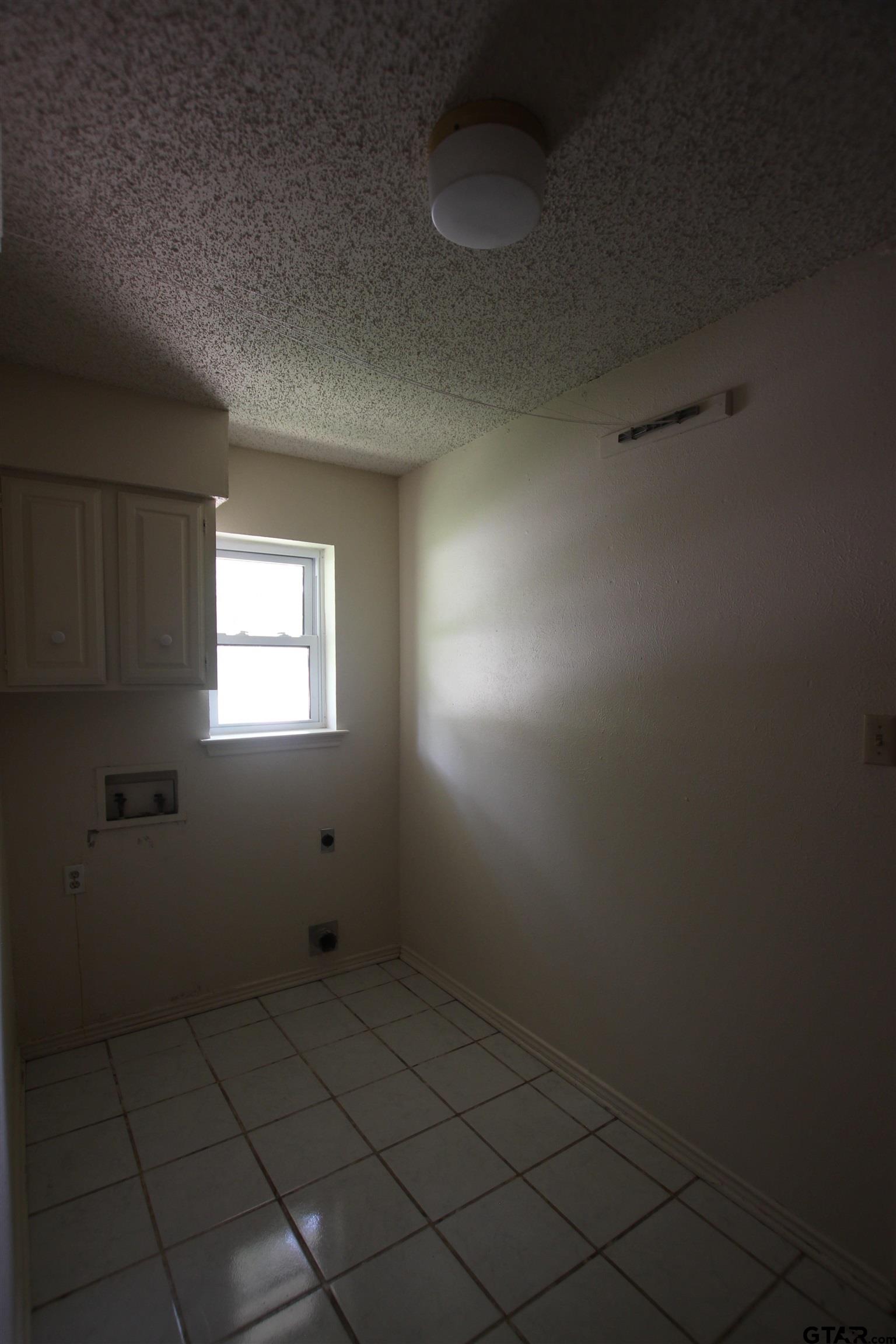 4210 Heather Lane Tyler, TX 75703 - Photo 11 of 27 a view of an empty room with a window
