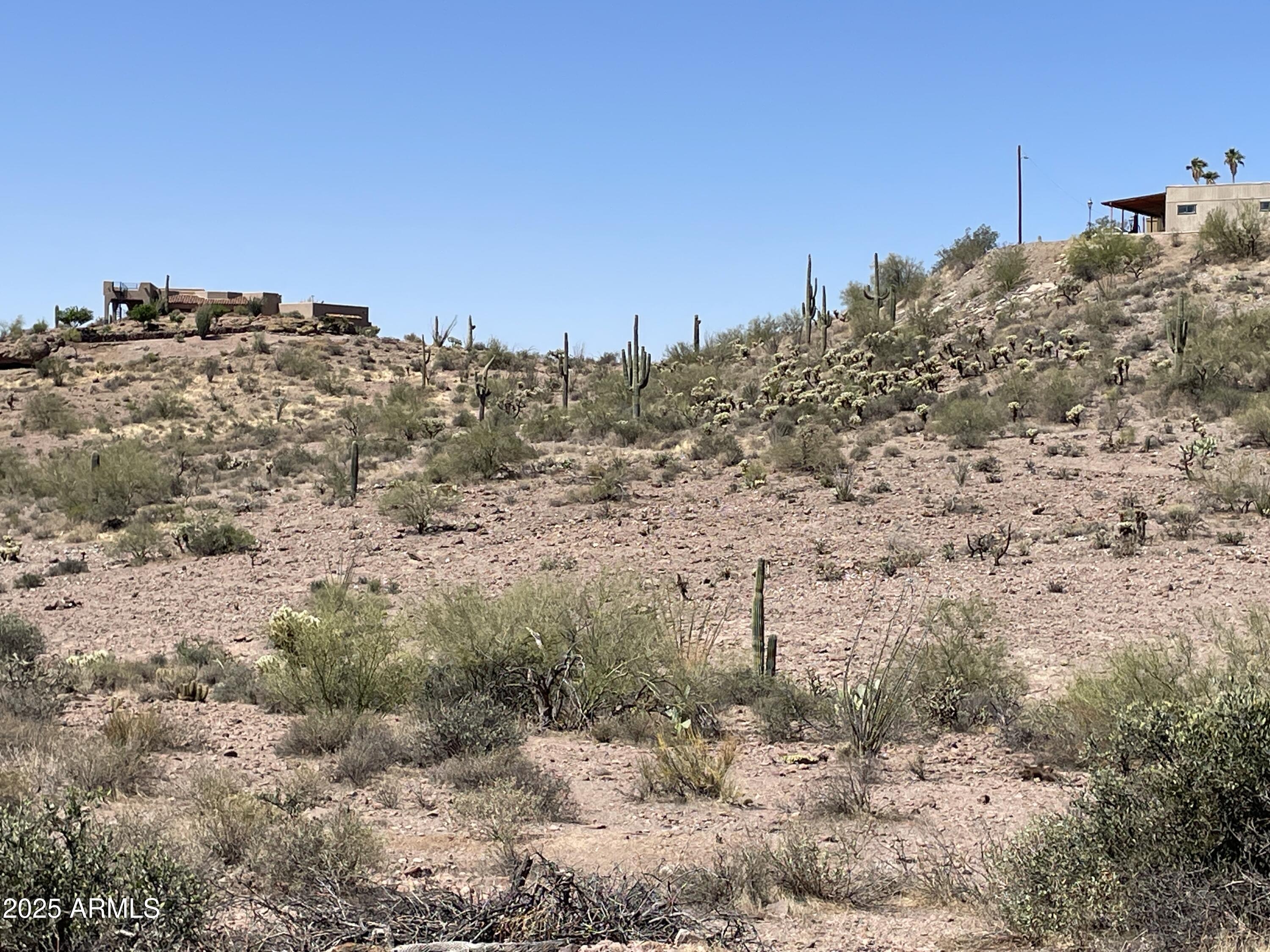 102 North Elephant Butte Road Gold Canyon, AZ 85118 - Photo 35 of 37 a view of a beach with a mountain in the background