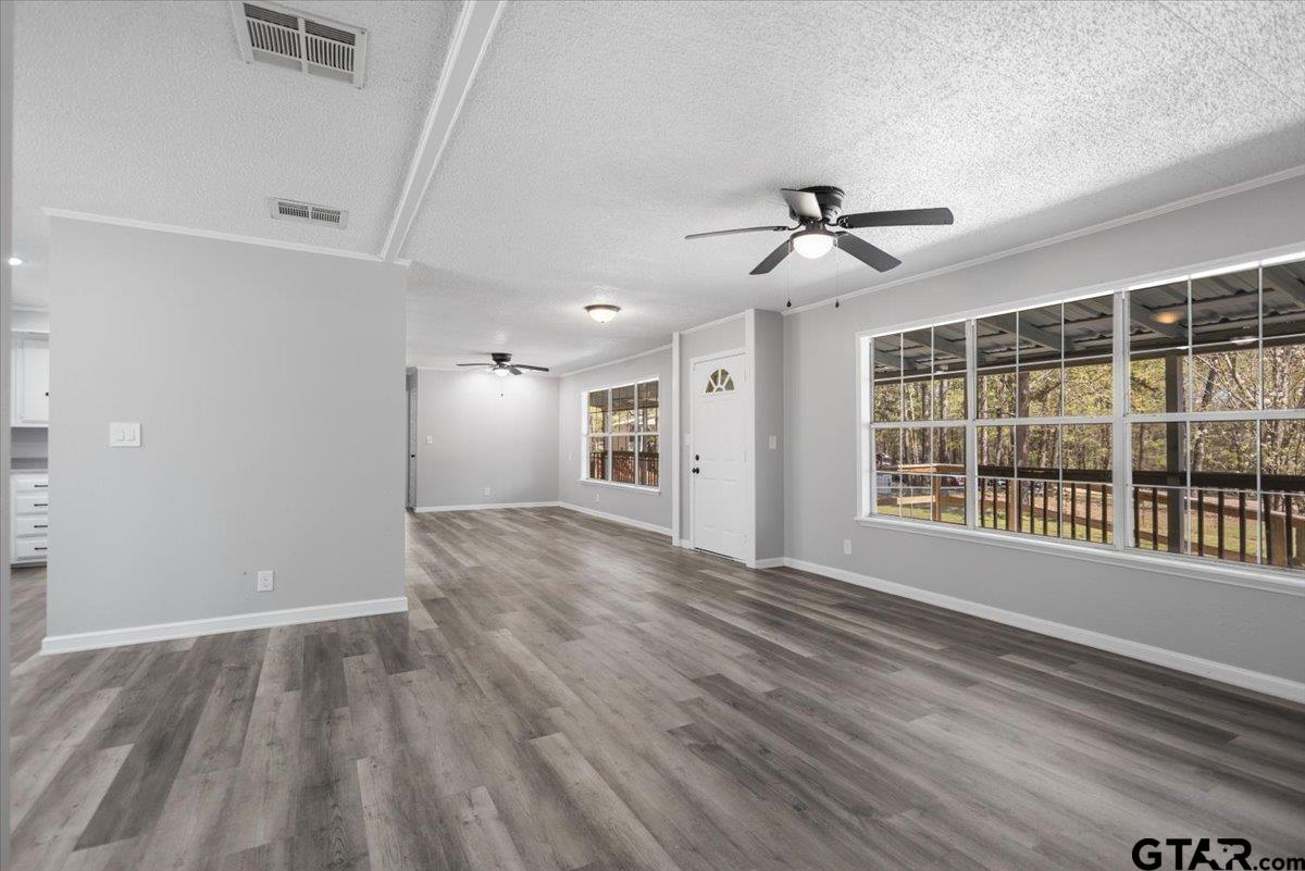 18607-c R 498 C R 498 Lindale, TX 75771 - Photo 13 of 41 a view of an empty room with a window and wooden floor