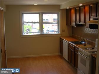 12131 Aster Road Philadelphia, PA 19154 - Photo 3 of 6 a kitchen with a stove and a refrigerator