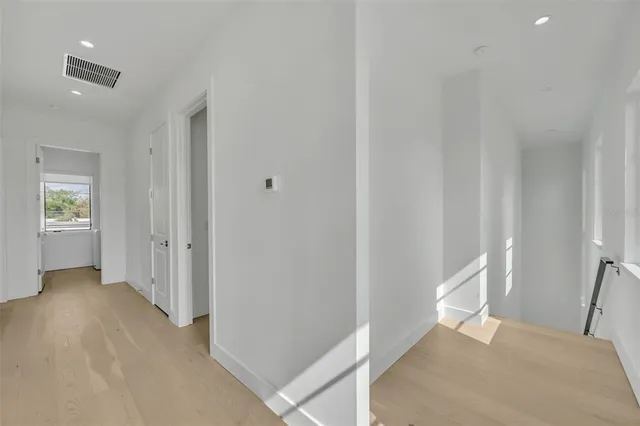 a bedroom with a bed and a table