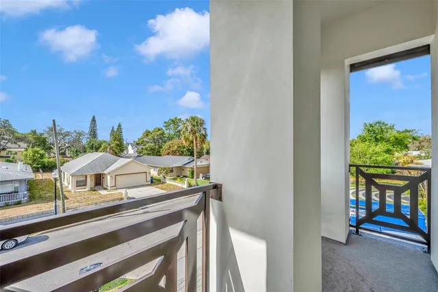 a view of balcony with furniture