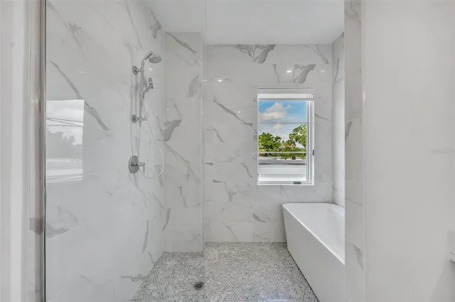 a bathroom with a bathtub and window