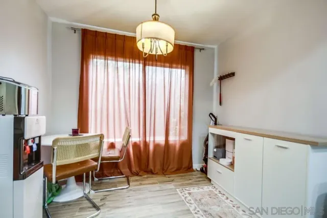 a view of a livingroom with furniture and a window