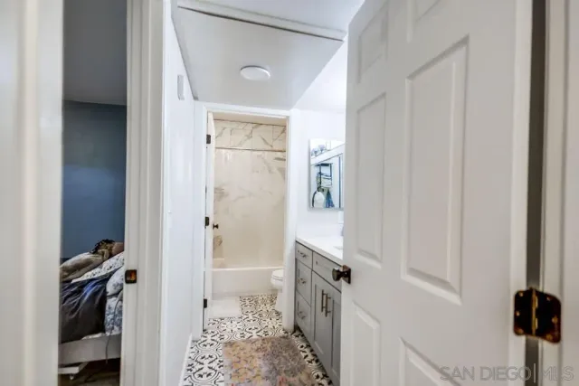 a view of a bedroom from a hallway