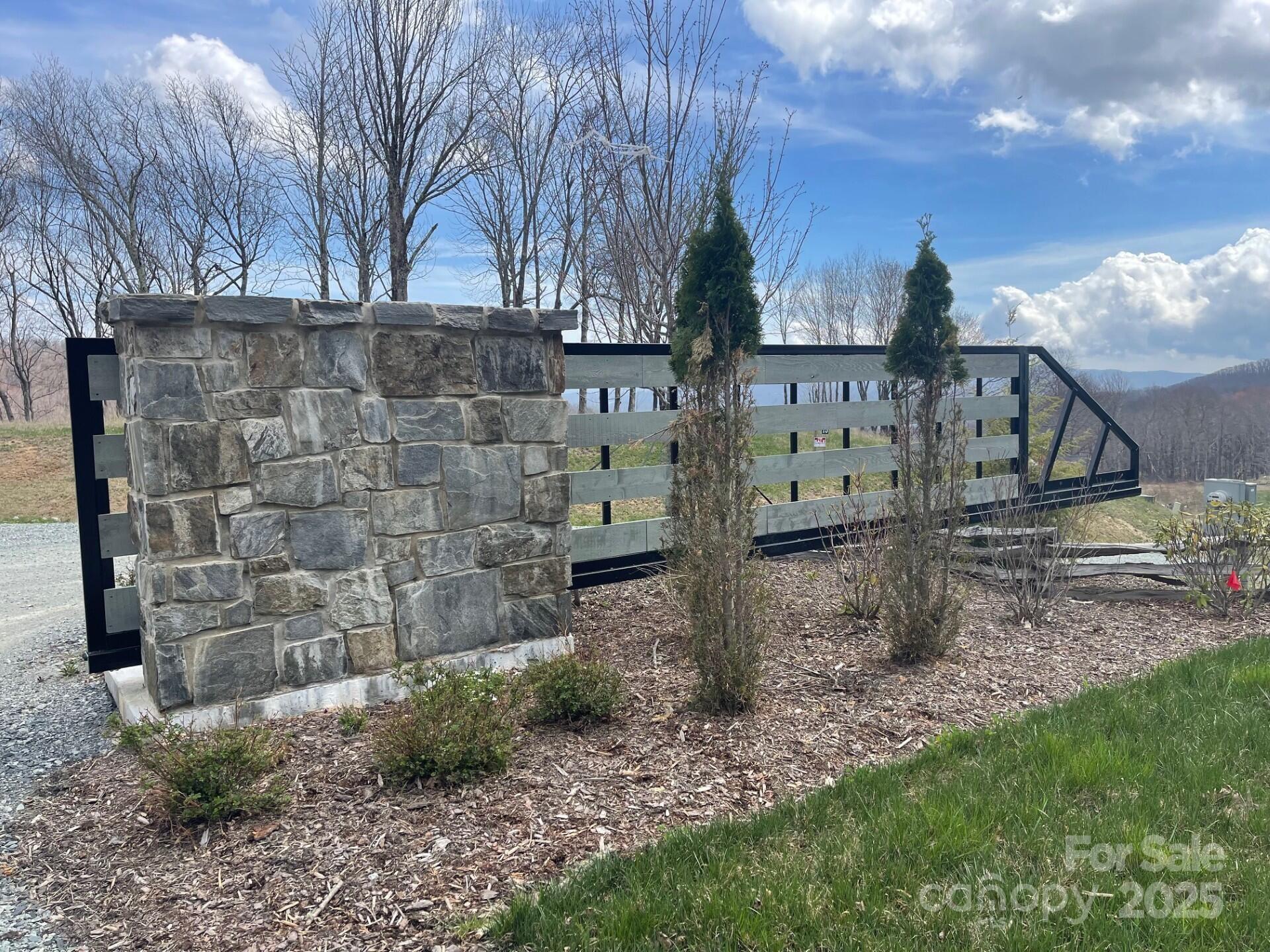 0 Lee Gualtney Road, Unit 15 Apex, NC 27523 - Photo 3 of 15 a view of a house with a yard and wooden fence