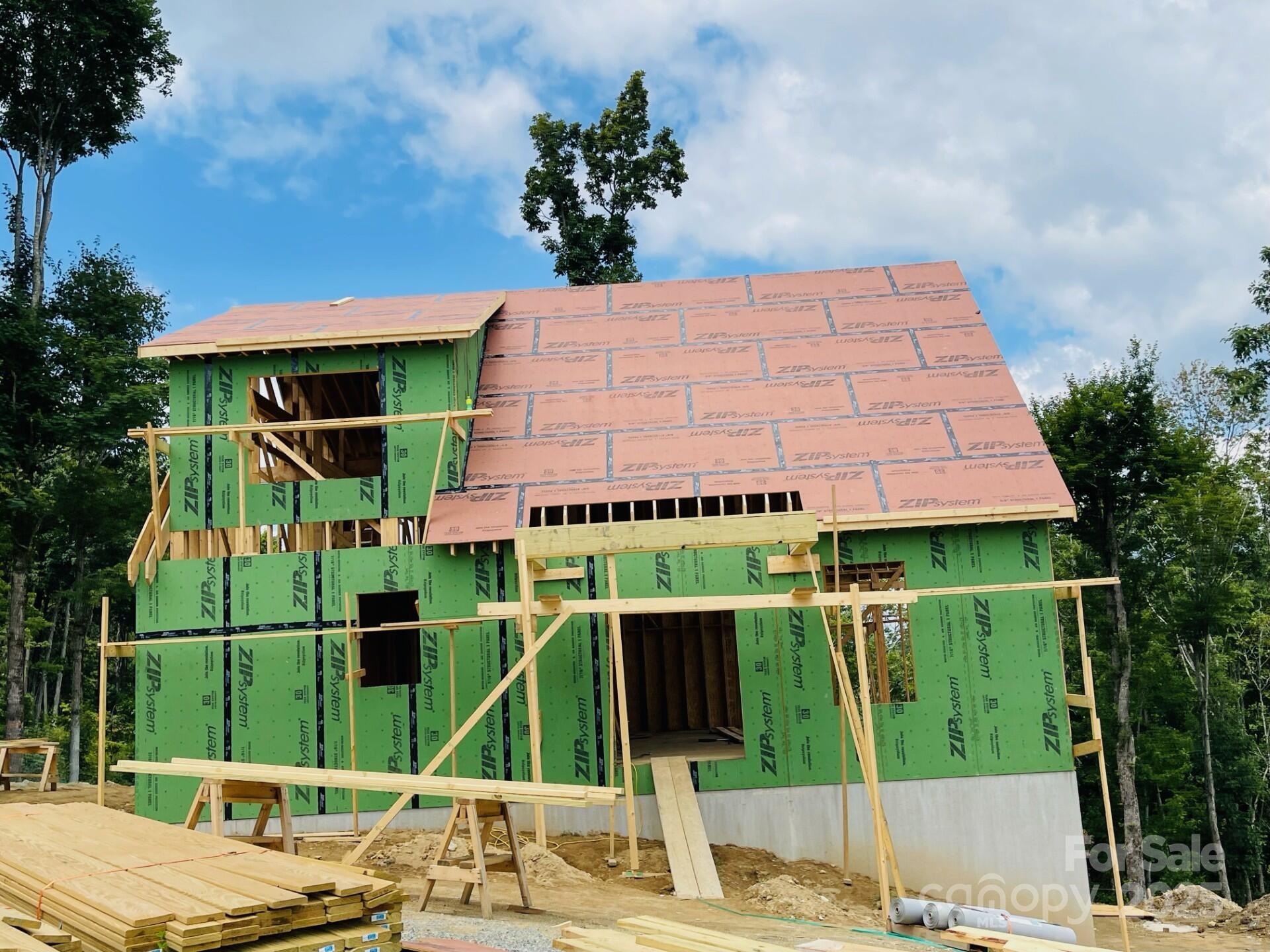 0 Lee Gualtney Road, Unit 15 Apex, NC 27523 - Photo 9 of 15 a front view of a house with garden